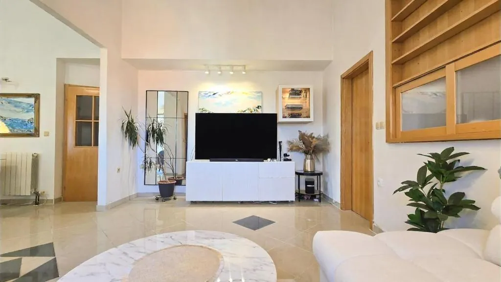 Spacious penthouse living room with a Smart TV