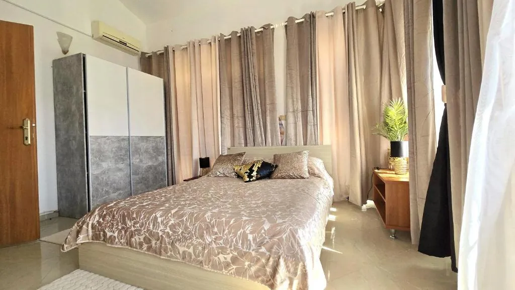 Bedroom with a double bed and large wardrobe