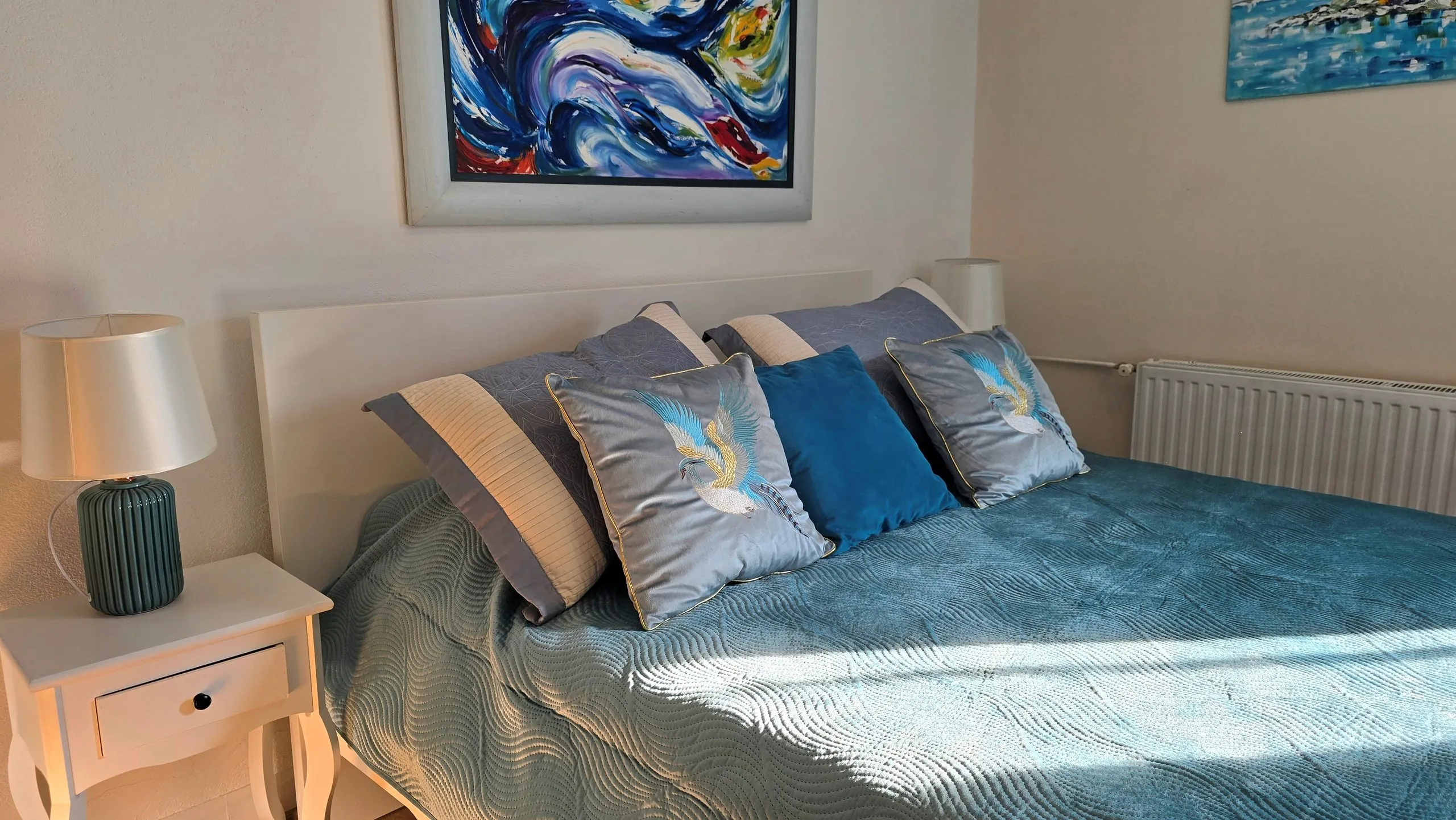 King room with a large double bed and original painting