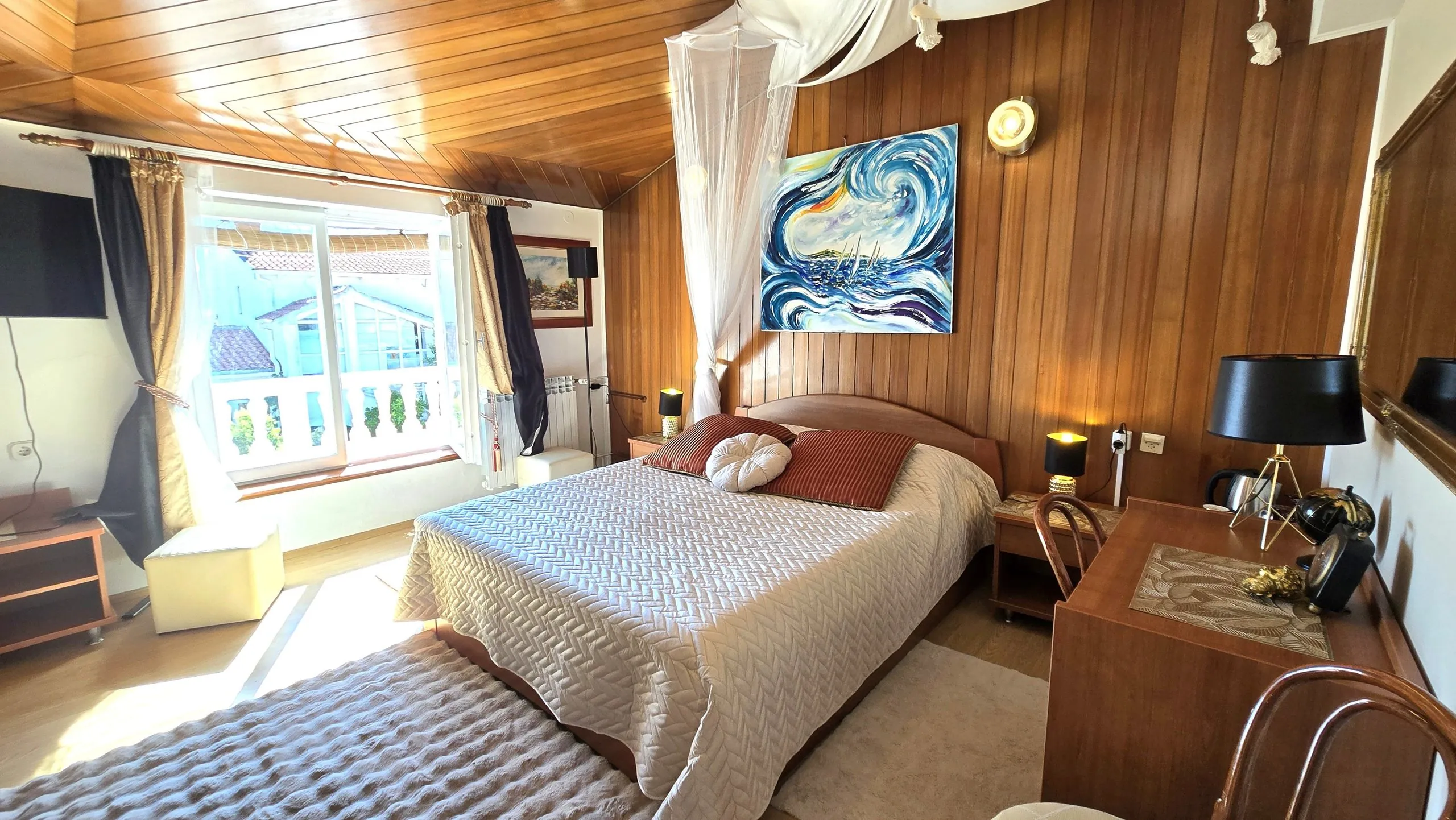 Triple room with wood-panelled walls, a desk and terrace access