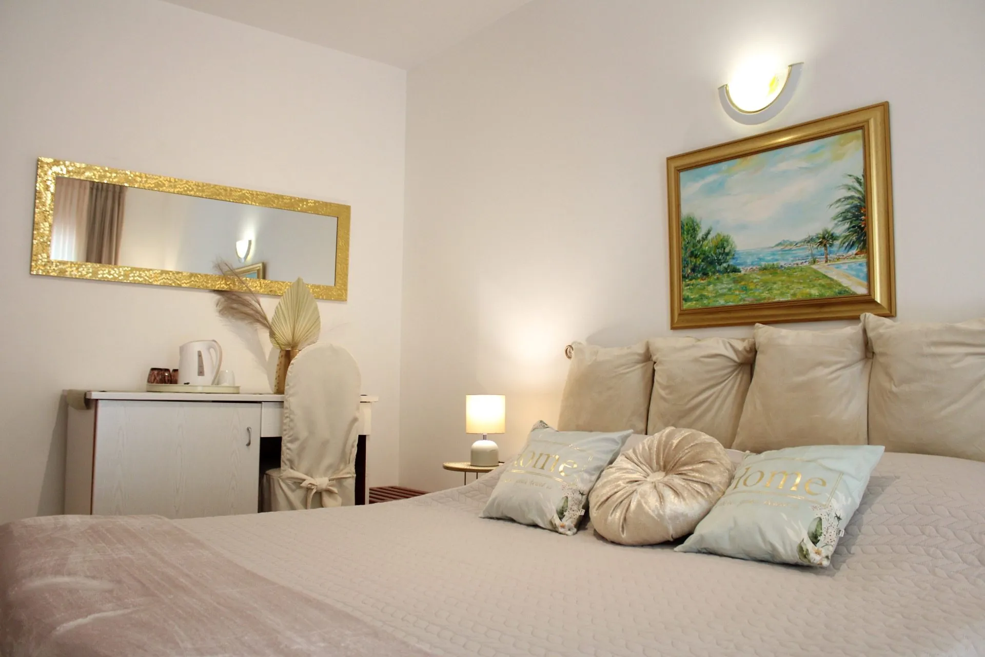 Triple room with balcony, kettle and seascape painting